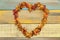 A potpourri heart on a wood background