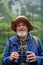 Potrait of active senior man hiking in autumn mountains.