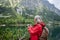 Potrait of active senior woman hiking in autumn mountains.