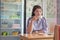 Potrait of a attractive asian women drinking cup a coffee at a cake store