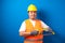 Potrait of fat asian worker wearing helmet and safety vest looking to camera