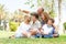 Potrait of grandfather pointing with family