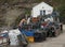 Pots and fishing boat equipment stacked outside the Staithes Harbour Office, Yorkshire, UK