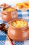 Pots of millet porridge with pumpkin