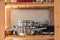 Pots and Pans on Wooden Kitchen Shelf Empty Space Cooking Equipment