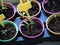 pots with seedlings. a tag with an empty space for your text was stuck in the ground. lettering on the tag. seedlings on the windo