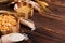 Pots, sparse and spoon with cereals on a napkin napkin on a wooden background