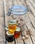 Pots of various honey and brown sugard on wooden table