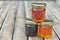 pots of various honey on a wooden table