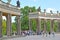 POTSDAM, GERMANY. Tourists about a colonnade of the palace of Frederick the Great in the Sanssousi park