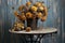 potted dried chrysanthemums on a metal garden table
