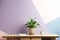 Potted peace lily plant, cup and notebook on wooden table