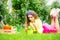 Potted plant, potting concept. Teenager girl holding flowers pot. Spring day.