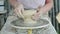 potter clay rotated in woman hands closeup, vintage crockery handmade technology,