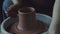 Potter makes a jug of clay