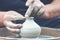 Potter making ceramic pot on the pottery wheel