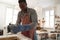 Potter preparing earthenware vessel for bisque firing