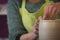 Potter`s hands making a clay pot on pottery