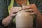 Potter`s hands making a clay pot on pottery