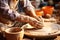 Potter shaping clay on a spinning wheel - stock photography concepts