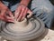 Potter spinning clay