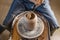 Potter working on a Potter`s wheel making a vase. Master processing the formed jug giving it the correct shape