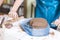 Pottering Concept. Closeup of Hands of Professional Female Ceramist During a Process of Clay Preparation With Wire on Table in