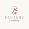 Pottery ceramics logo design. Vase and branch vector logotype.