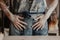 Pottery, clay, ceramics art concept - closeup on hands of young master in front of table