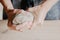 Pottery, clay, ceramics art concept - closeup on hands of young master with the large pieces of fireclay