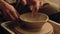 Pottery hobby art therapy hands molding clay bowl