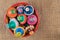 Pottery lids stacked in a pottery bowl on sackcloth background