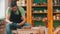 Pottery - master in green t-shirt is drying a clay bowl with a construction hairdryer