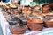 Pottery for sale. Traditional Ceramic Jugs. Handmade Ceramic Pottery in a Roadside Market with Ceramic Pots and Clay Plates