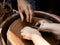Pottery training. The hands of the pupil and master over the pot