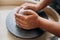 Pottery wheel, clay, woman`s hands, potter is going to work in pottery