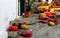 Pouffes and colorful cushions over a perron in a picturesque street