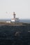 Poulains lighthouse on coast of the Atlantic Ocean at the northern tip of Belle Ile, Brittany France