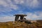 Poulnabrone dolmen, a portal tomb in The Burren in Ireland