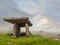 Poulnabrone Dolmen relict building in County Clare near Ballyvaughan town, famous Burren area of Ireland, Beautiful sun rise sky,