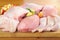 Poultry meat arrangement on kitchen board