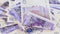 Pound sterling bank notes business background rotating