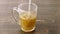 Pour hot water onto herbal medicine tablet in an empty glass. Stir with teaspoon