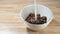 Pour milk into chocolate corn flake, slow motion