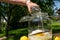 Pour the vodka into the big preserving jar with the fresh elderflowers, oranges and lemon slices, sugar and the vanilla pod