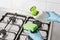 Pour washing detergent from bottle to green sponge