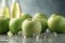 Poured green apple sparkling juice, apples, product shot AI generated