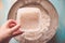 Pouring active yeast in a bowl with flour