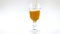 Pouring apple cider in nice glas on white background