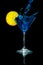 Pouring Blue Martini into the Martini Glass with Lemon